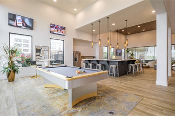 social lounge with billiards at Reveal Skyline apartments